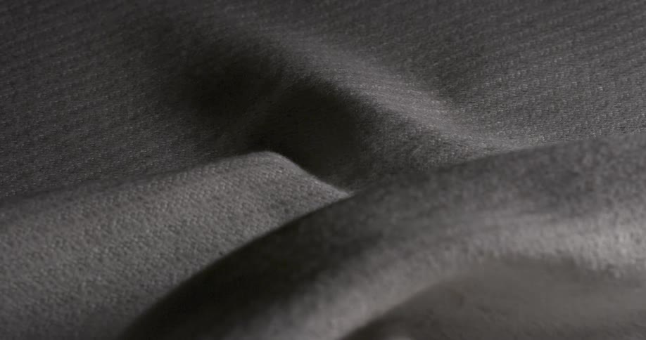 Lighting on a woven white garment at night
