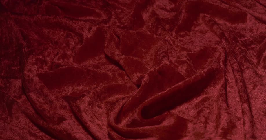 Texture of red knit fabric with light passing and dimming