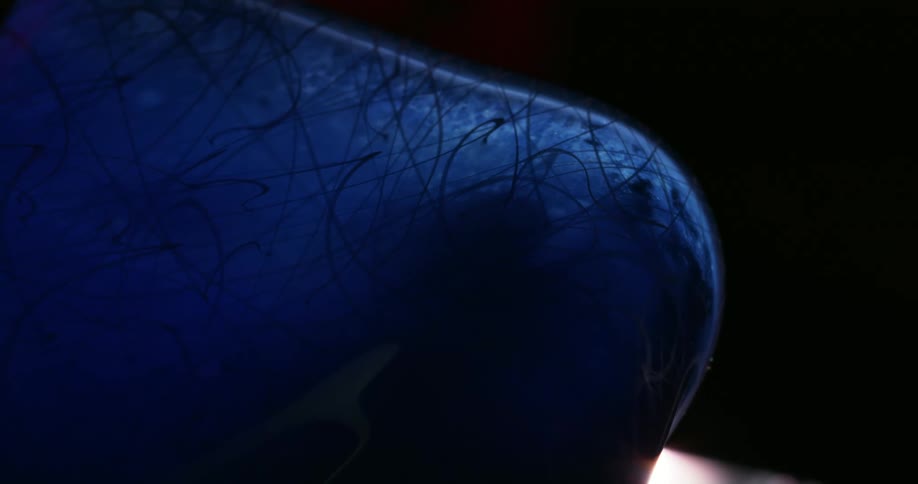 A piece of blue decorative glass with black lines