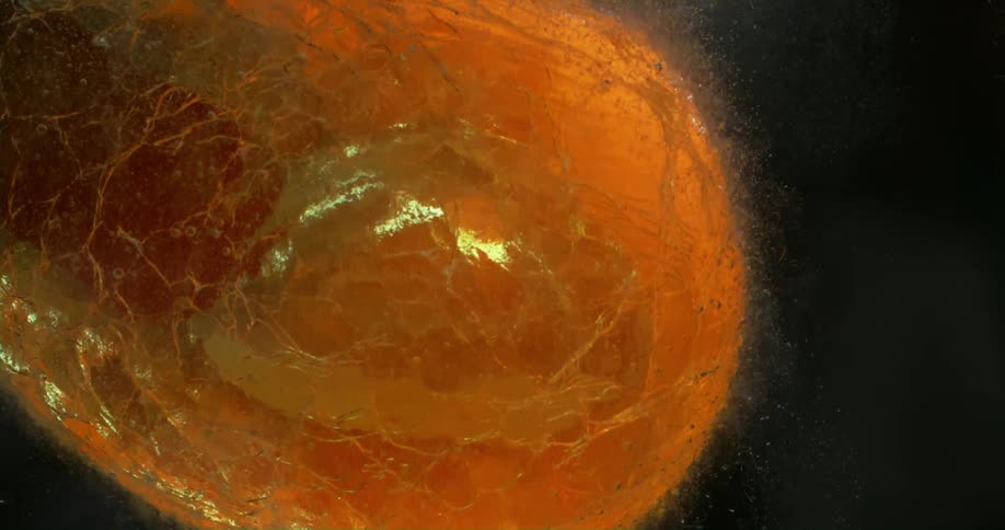 Hot blown glass glassware cools submerged in water