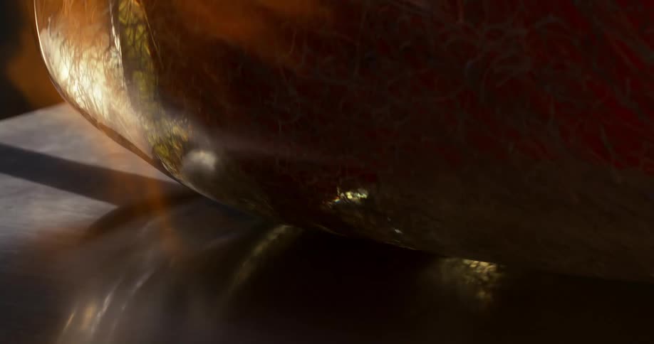 Glass vase receiving waves of fire for its finishing