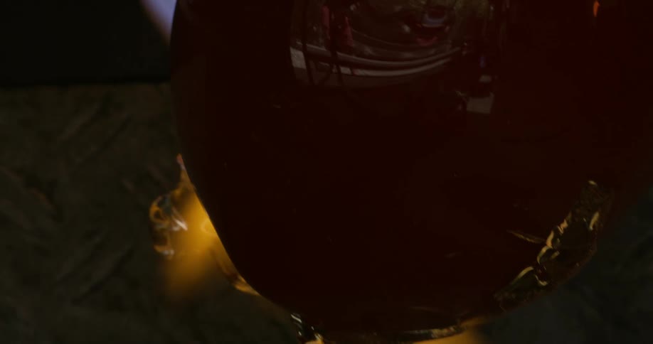 A glass vase being melted by a blowtorch