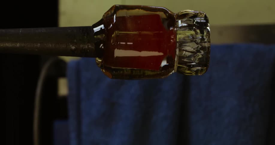 A spinning piece of glassware at the tip of a blowpipe