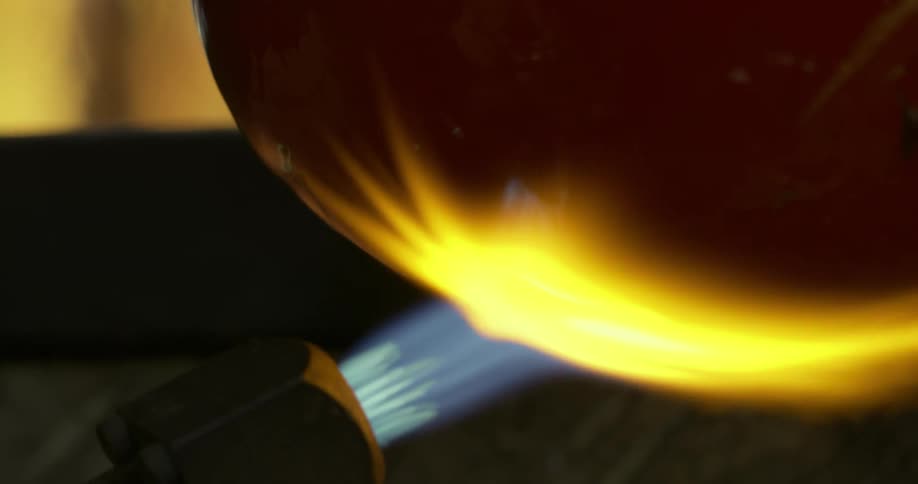 Torch being applied to a glass sphere