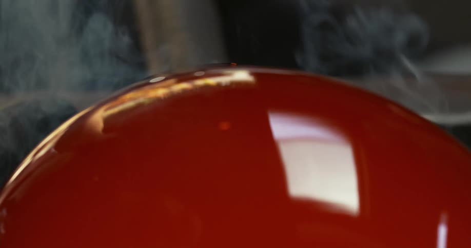 A closeup of the production of a glass vase