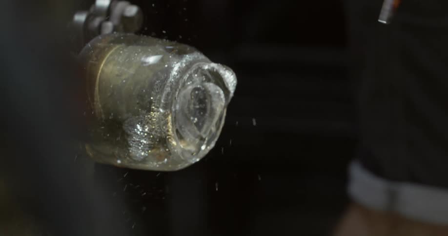 Glass tip from a recently crafted piece of glassware breaking off