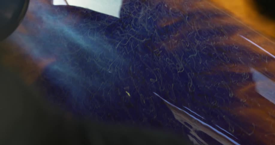 A large torch is spinning the glass