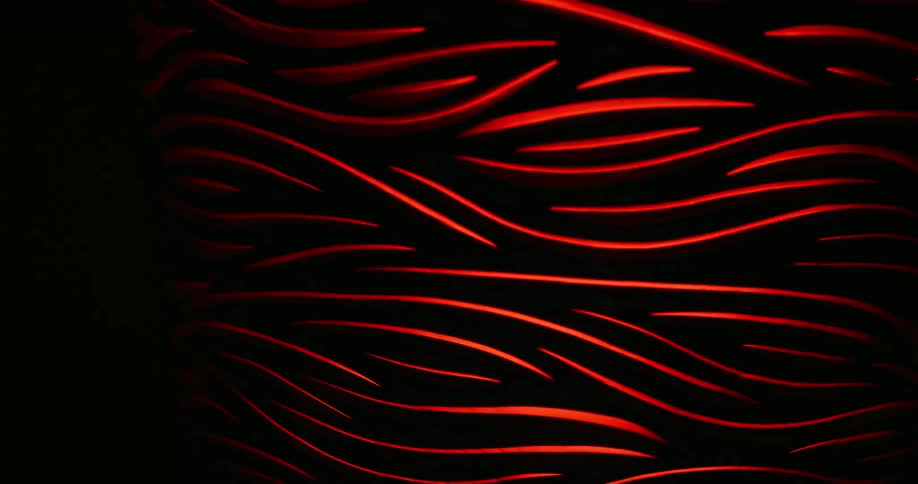 Red light in swerve lines shines in a dark place