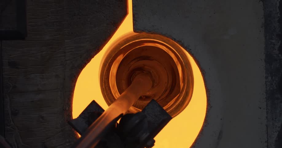 Closeup of glass manufacturing being produced inside a furnace