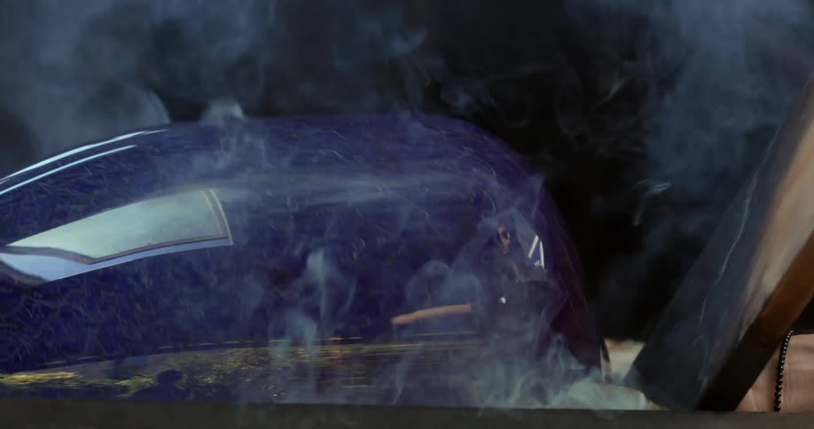 Smokes coming out of burning plank