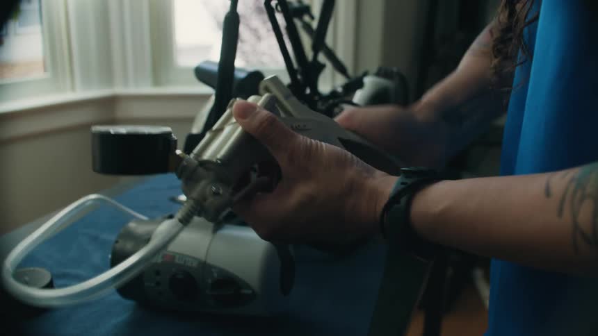 Underwater photographer prepares a camera for a photo shoot at home