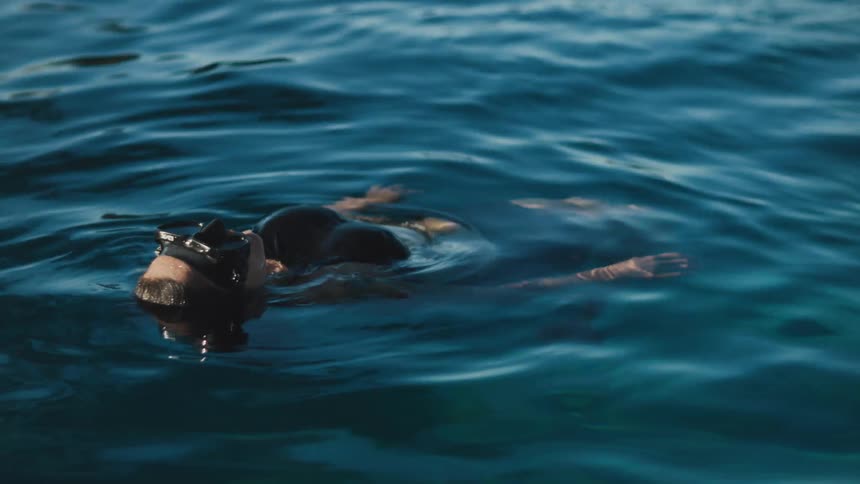 A woman is floating in the water