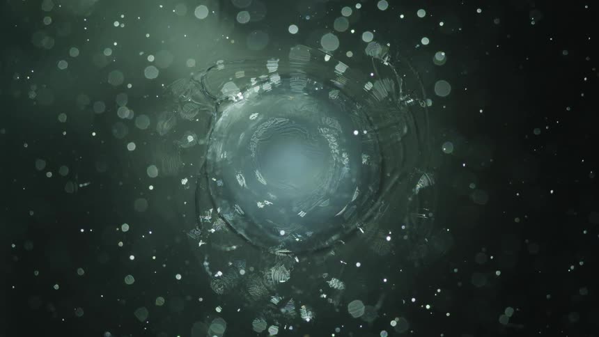 A drop falling and causing ripples in the water