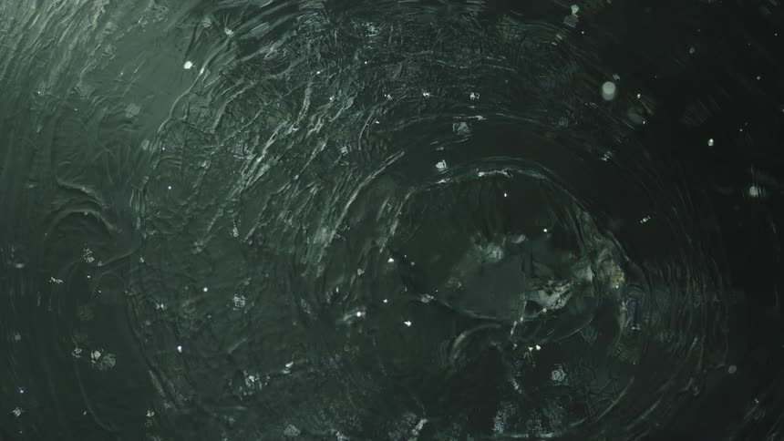 Ripples in a clear liquid in slow motion