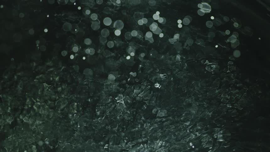 Close up of abstract dark green water texture
