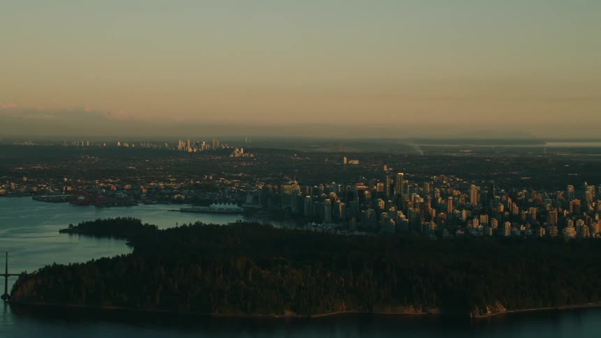 Aerial of stanley park and lions gate bridge at sunrise