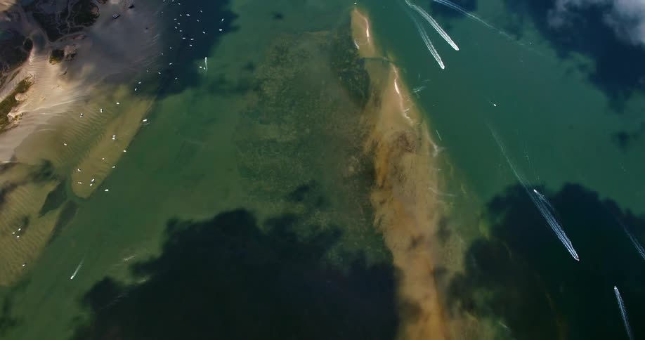 Aerial of boats traveling on lake