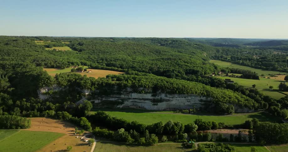 The farms are green on a sunny day