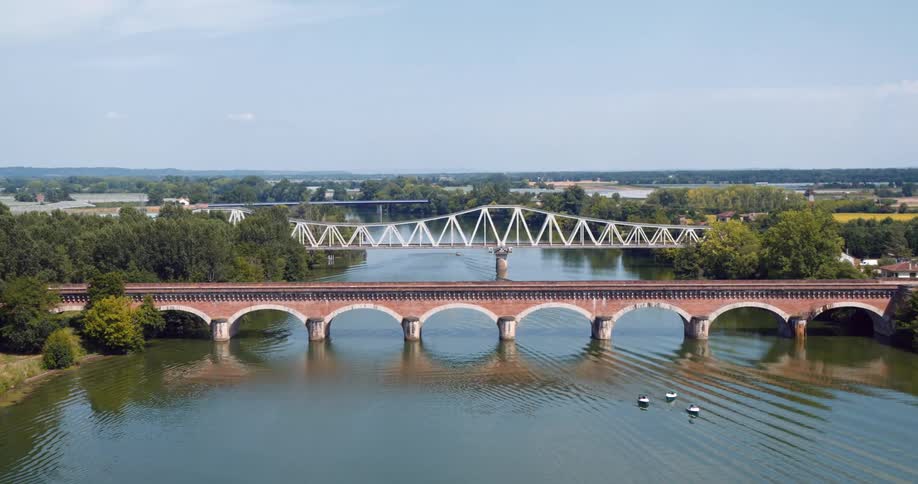 Aerial view of two bridges over a lake