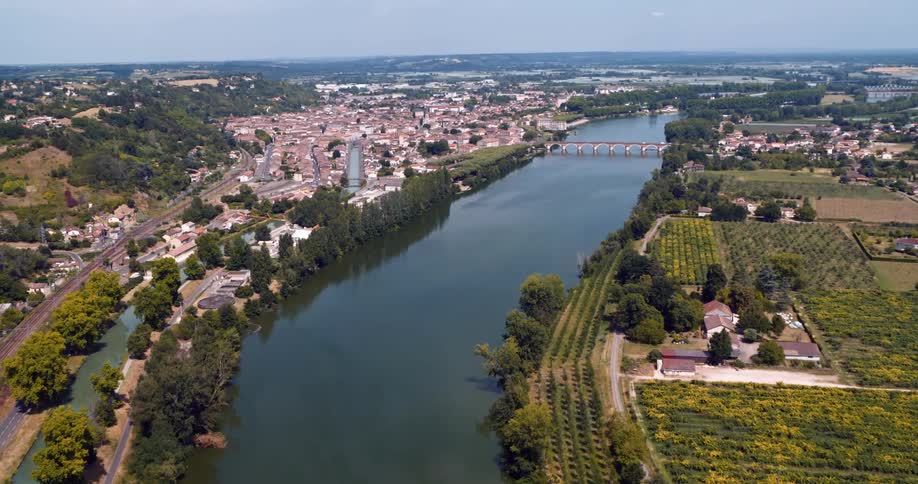 The bridge runs over the river in town