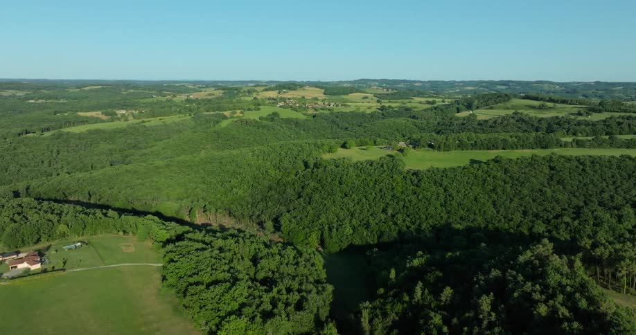Aerial of green countryside with a valley