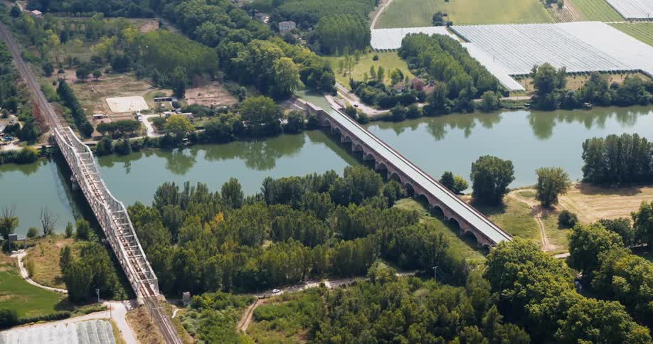 Aerial of two bridges over calm river