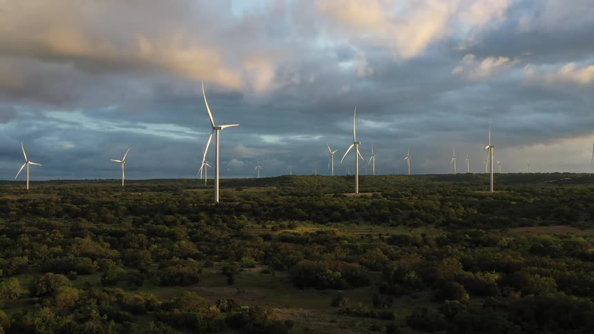 Aerial of wind turbines on wind farm on a cloudy day