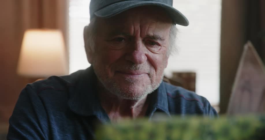 A man is looking through a photo album