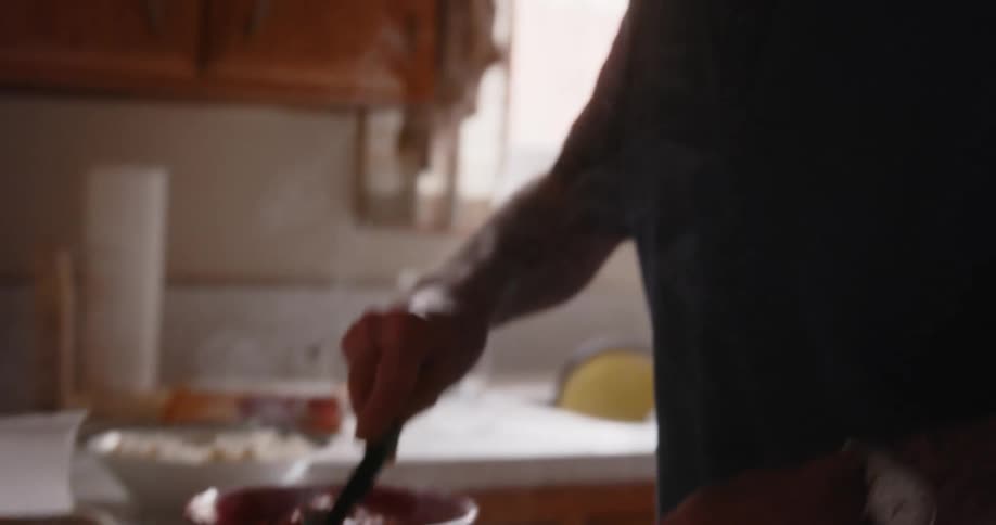 A man is serving hot food at home