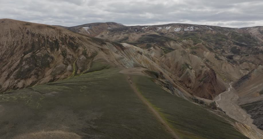 An aerial view of a mountain range covered in dirt