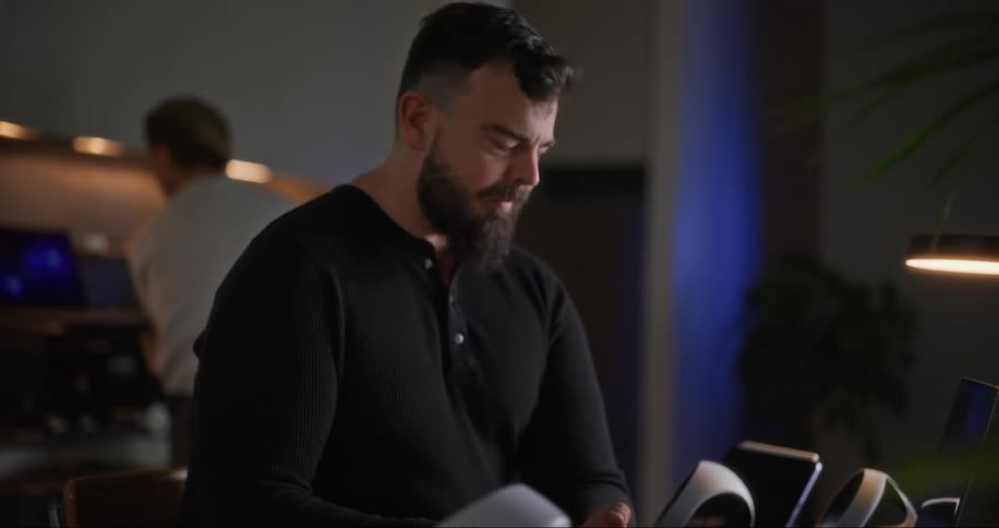 A man is typing on his laptop