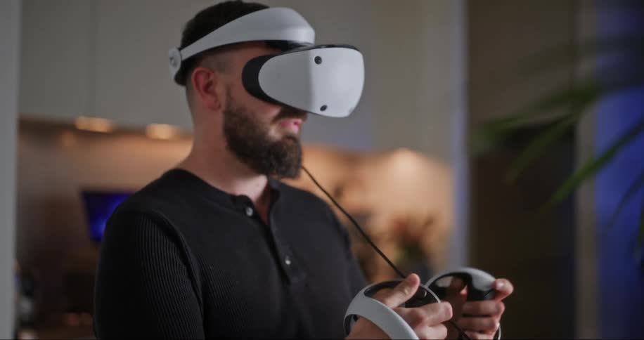 A man testing and interacting with virtual reality glasses and hand sensors