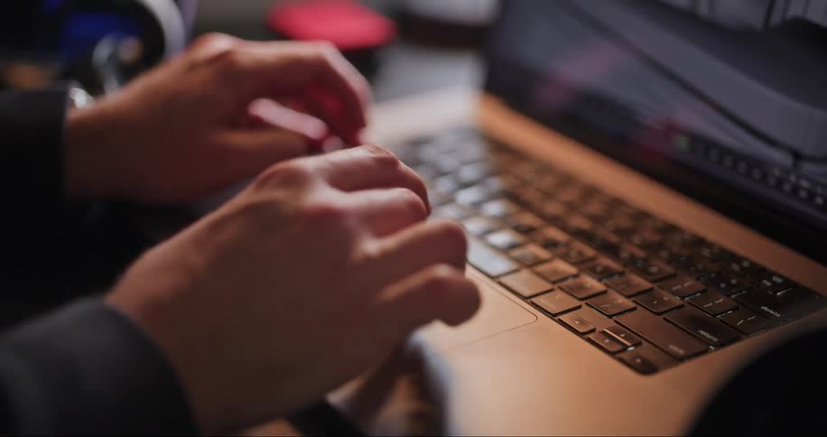 Designer works on a 3d model in a laptop