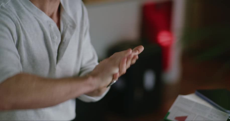 Man cleans his hands with hand sanitizer
