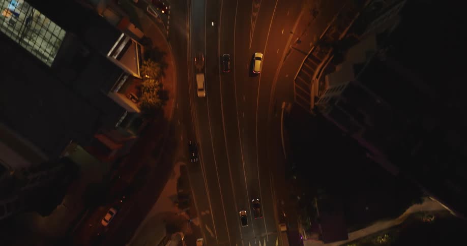 Aerial of an illuminated bridge in an urban city at night