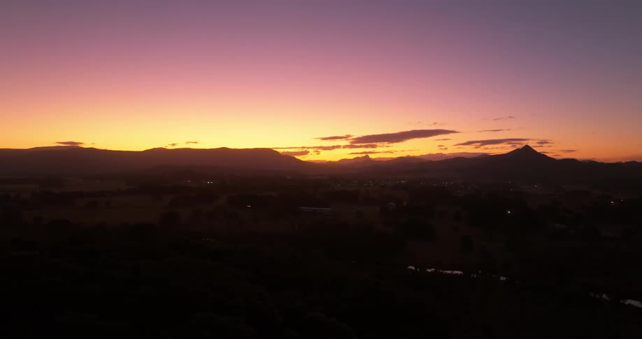 Aerial view of a town in the countryside at sunset