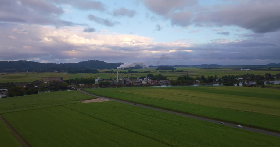 A small town is surrounded by grass