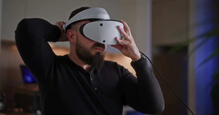 A man puts on a virtual reality headset