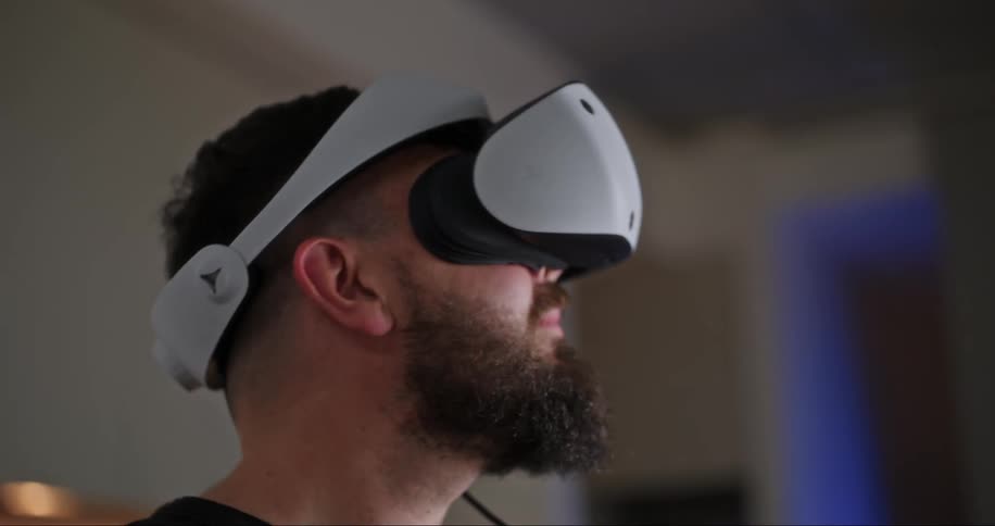 A man removes his virtual reality headset