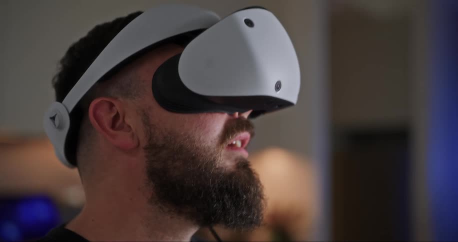 A man puts on his virtual reality headset