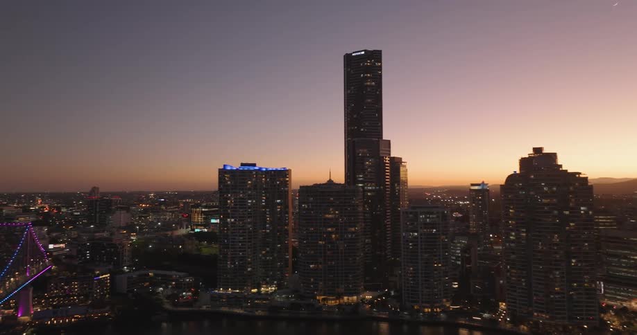 Aerial view of the colorful city skyline at evening