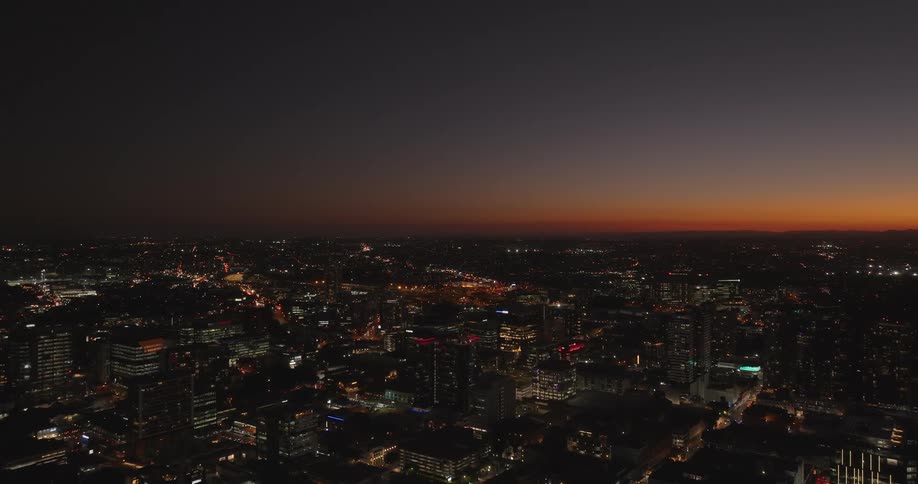 Metropolitan city skyline illuminated at night
