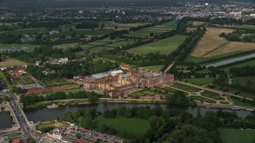 A large structure of ancient architecture surrounded by lakes and rivers
