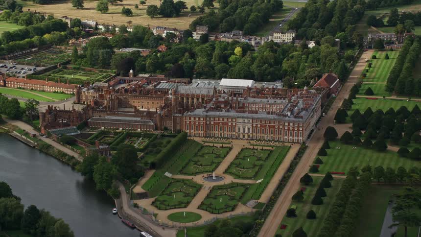 A large manor of ancient architecture surrounded by lakes and rivers