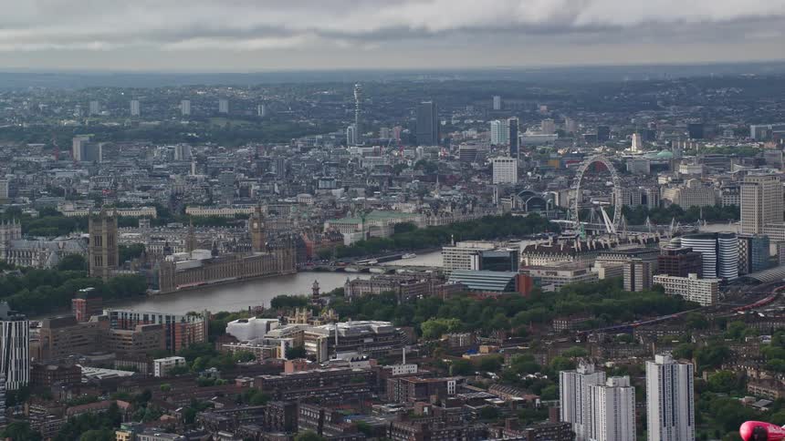 Aerial view of a city with a bridge spanning a river within the urban area numerous skyscrapers and series of buildings