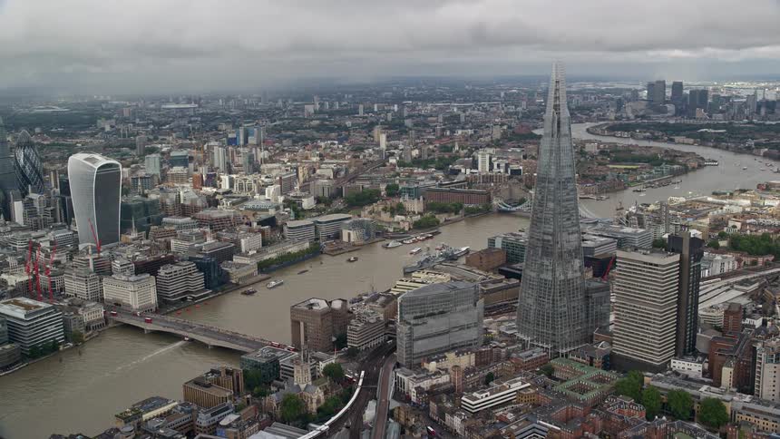 Aerial of metropolitan city with glass tower during daytime