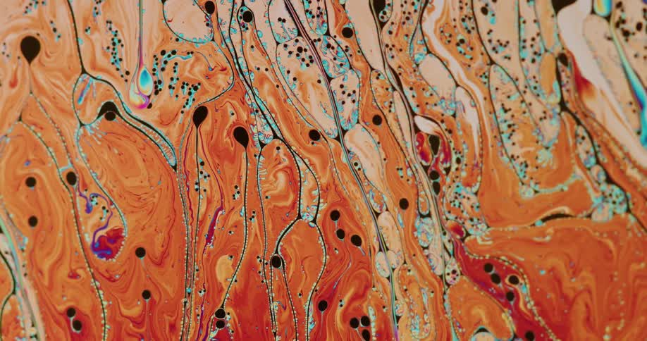 Ribbons of blue swirling and flowing in orange