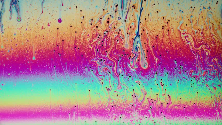 Close up of abstract rainbow drip