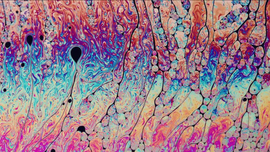 The rainbow colors move around in the liquid