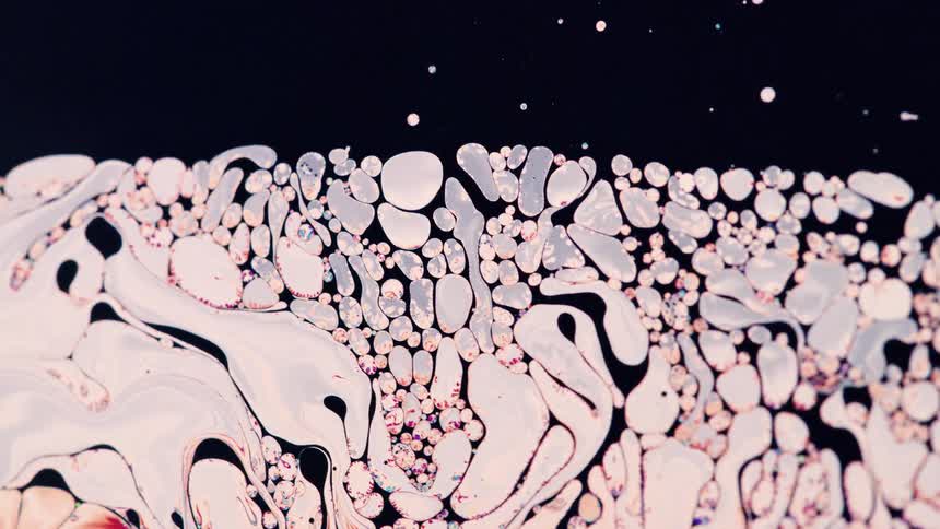 A liquid of black and white colors moving randomly